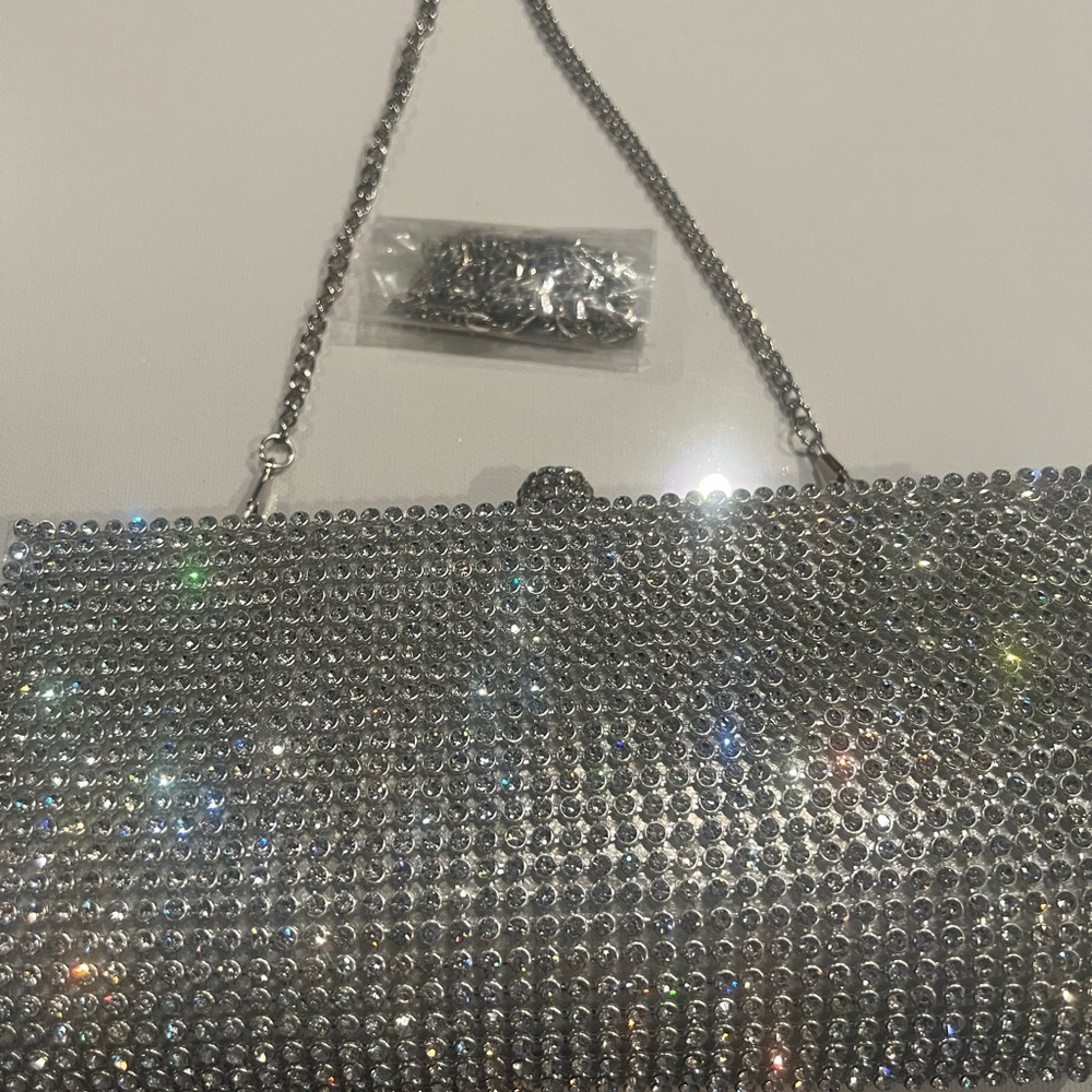 Silver rhinestone evening clutch with two straps. Interchangeable